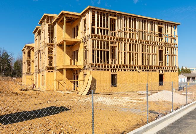 a close-up of temporary chain link fences enclosing a construction site, signaling progress in the project's development in Doswell VA